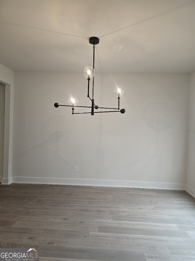128 Patillo Manor, Unit 7 Stockbridge, GA 30281 - Photo 19 of 37 a view of a room with wooden floor and window