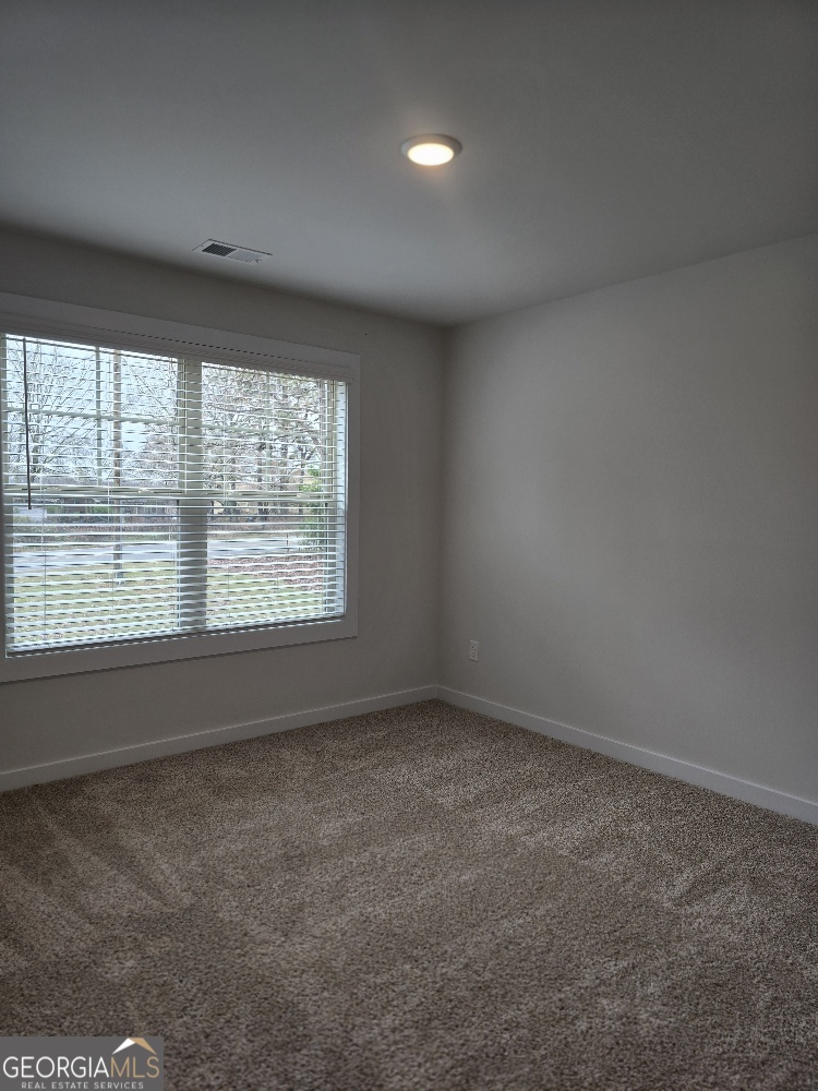 128 Patillo Manor, Unit 7 Stockbridge, GA 30281 - Photo 24 of 37 an empty room with a window