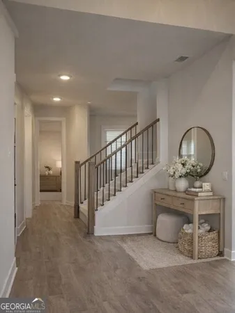 a view of an entryway with wooden floor