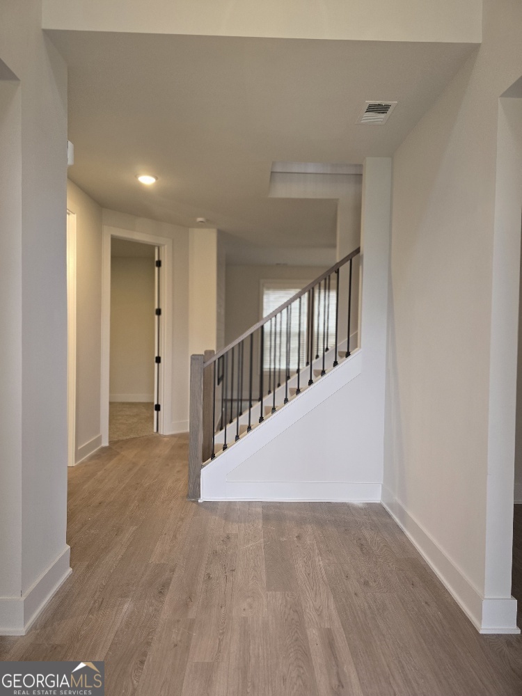 128 Patillo Manor, Unit 7 Stockbridge, GA 30281 - Photo 5 of 37 a view of an entryway with wooden floor