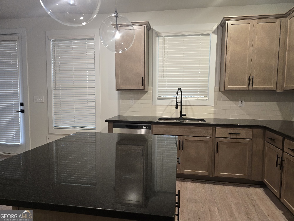 128 Patillo Manor, Unit 7 Stockbridge, GA 30281 - Photo 7 of 37 a bathroom with a sink and a mirror