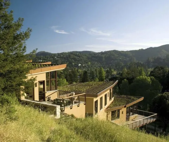 an aerial view of a house with a yard