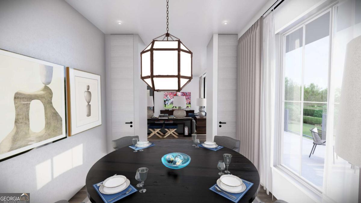 1554 South Lumpkin Street, Unit 5 Athens, GA 30605 - Photo 14 of 24 a view of a dining room with furniture a chandelier and wooden floor