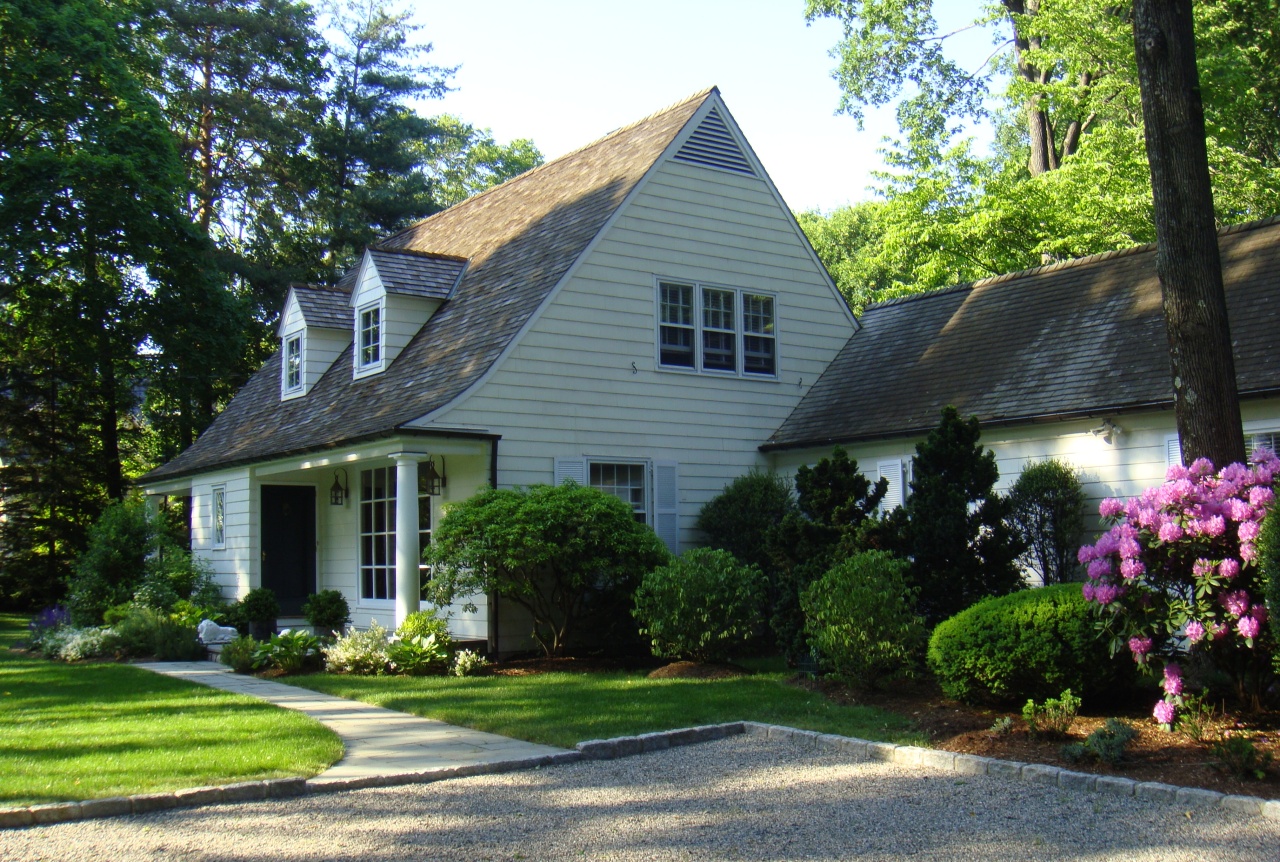 159 Oenoke Ridge New Canaan, CT 06840 - Photo 1 of 28 a front view of a house with a yard and potted plants