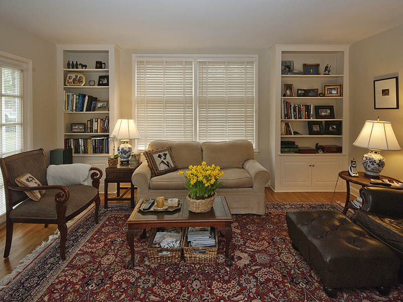 159 Oenoke Ridge New Canaan, CT 06840 - Photo 12 of 28 a living room with furniture or couch and a bookshelf