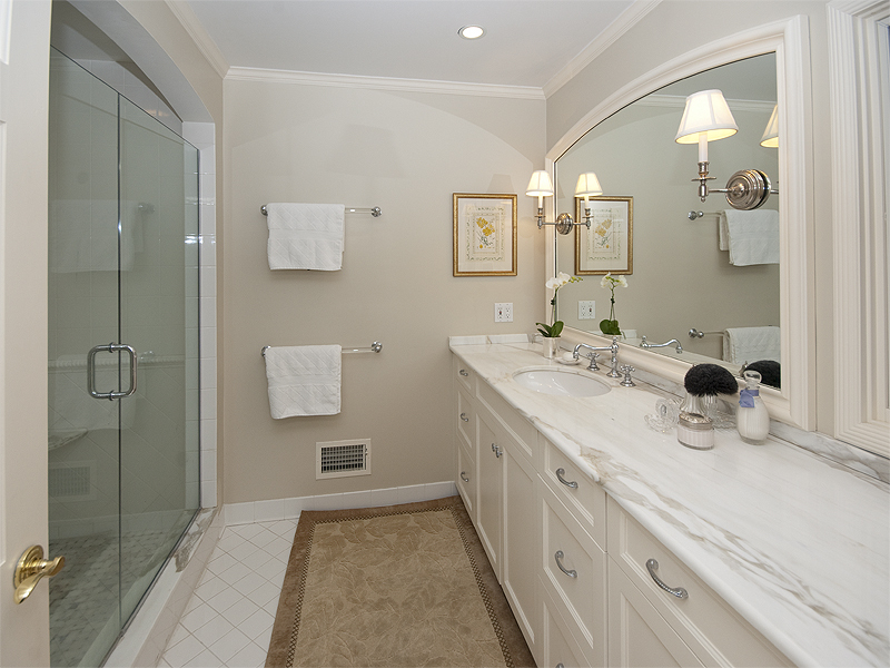 159 Oenoke Ridge New Canaan, CT 06840 - Photo 21 of 28 a bathroom with a sink and a mirror