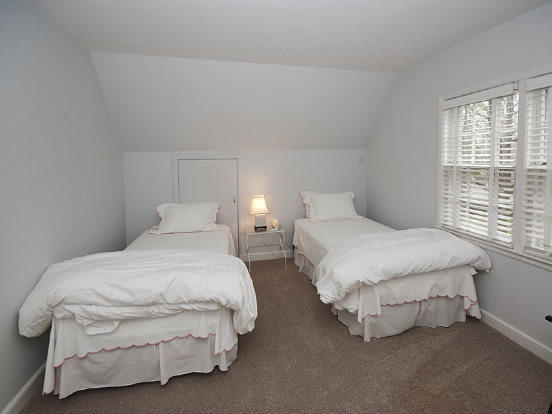159 Oenoke Ridge New Canaan, CT 06840 - Photo 26 of 28 a bedroom with two beds and a window