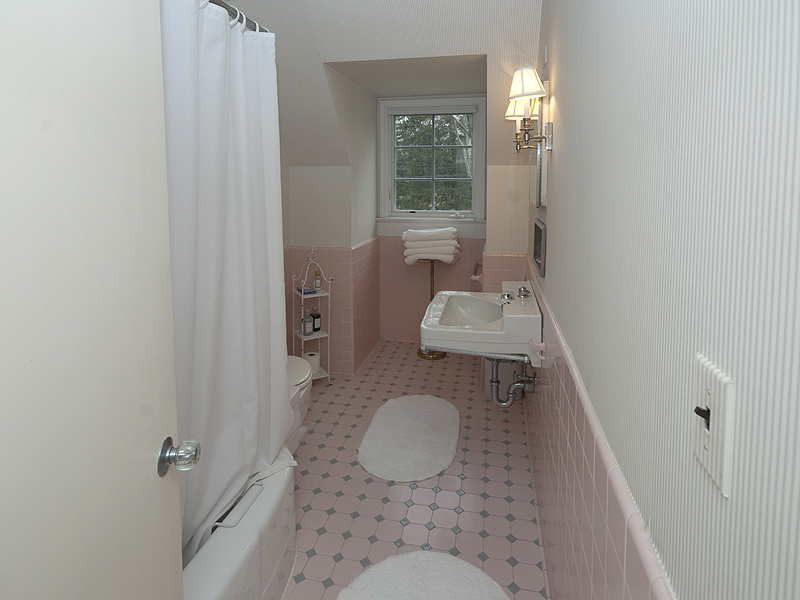 159 Oenoke Ridge New Canaan, CT 06840 - Photo 27 of 28 a bathroom with a sink toilet and window