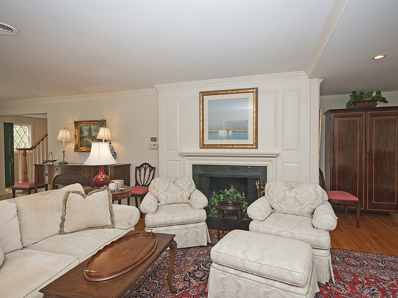 159 Oenoke Ridge New Canaan, CT 06840 - Photo 9 of 28 a living room with furniture potted plant and a fireplace