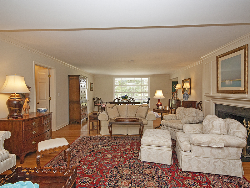 159 Oenoke Ridge New Canaan, CT 06840 - Photo 10 of 28 a living room with furniture a lamp and a large window
