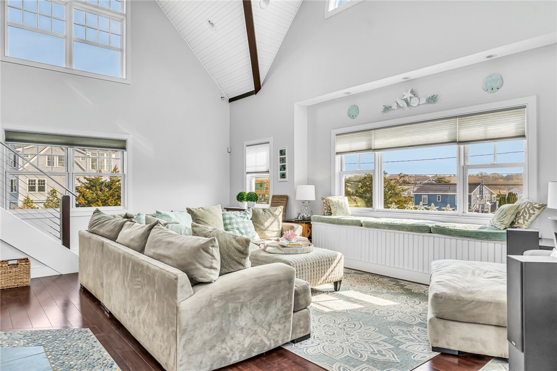 32 Breach Drive Westerly, RI 02891 - Photo 15 of 43 The living room features large and beautiful hurricane resistant windows.