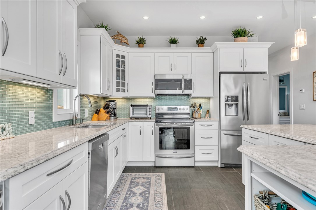 32 Breach Drive Westerly, RI 02891 - Photo 18 of 43 The kitchen island is situated so that people can move about the kitchen unimpeded when entertaining.