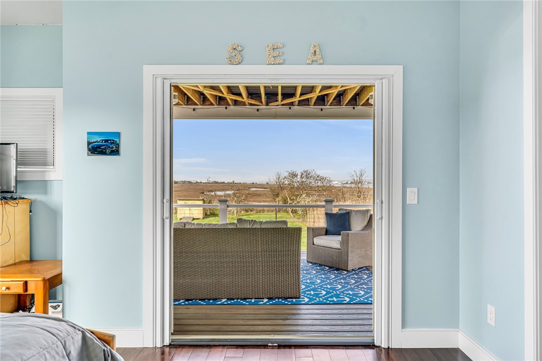 32 Breach Drive Westerly, RI 02891 - Photo 25 of 43 From the second floor bedroom, enjoy the covered deck with water views.