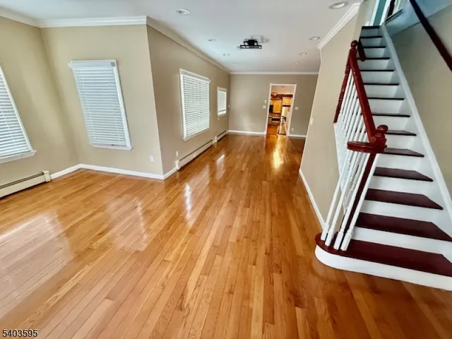 a view of an entryway with wooden floor