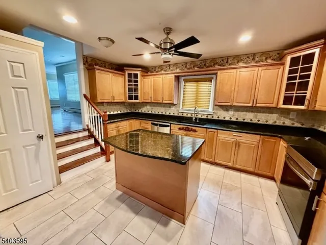 a view of a kitchen with a sink and a microwave