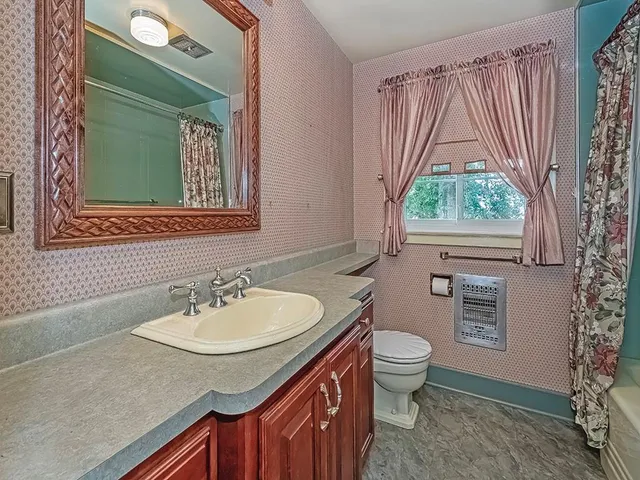 a bathroom with a tub and shower