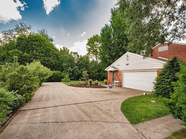 a backyard of a house with yard and outdoor seating