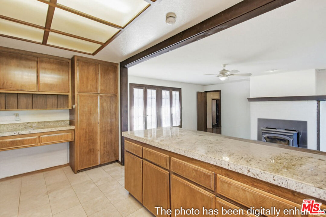 3709 Buena Creek Road Vista, CA 92084 - Photo 12 of 62 a bathroom with a granite countertop sink and washing machine