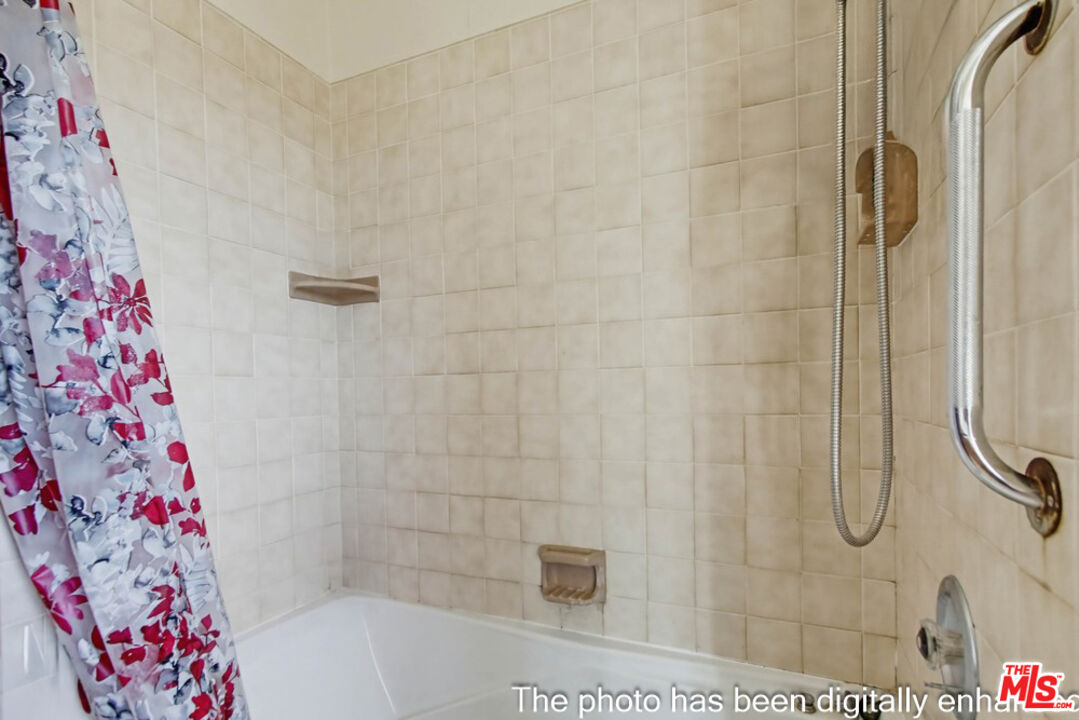 3709 Buena Creek Road Vista, CA 92084 - Photo 27 of 62 a bathroom with a bathtub and shower