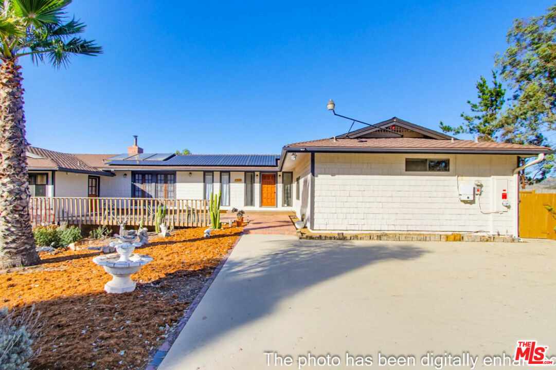 3709 Buena Creek Road Vista, CA 92084 - Photo 4 of 62 a front view of a house with a yard