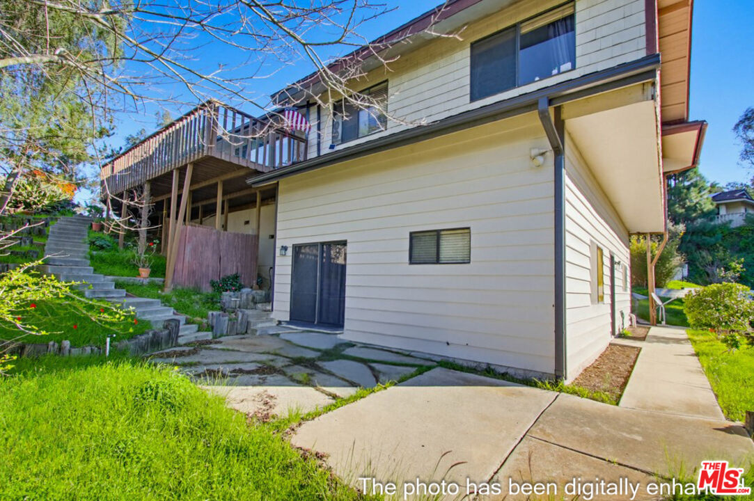 3709 Buena Creek Road Vista, CA 92084 - Photo 42 of 62 a view of a brick house with potted plants