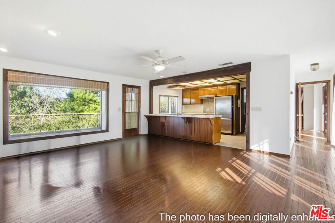3709 Buena Creek Road Vista, CA 92084 - Photo 6 of 62 a view of an empty room with wooden floor and a window