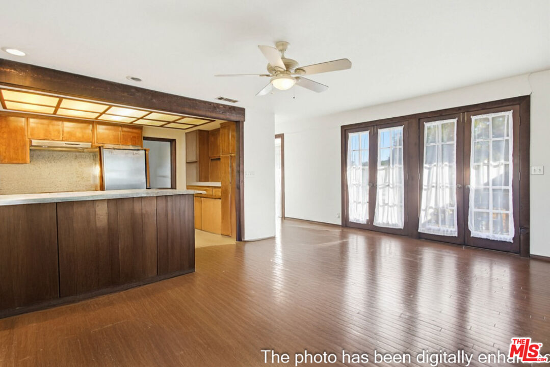 3709 Buena Creek Road Vista, CA 92084 - Photo 9 of 62 a view of a big room with wooden floor fan and windows