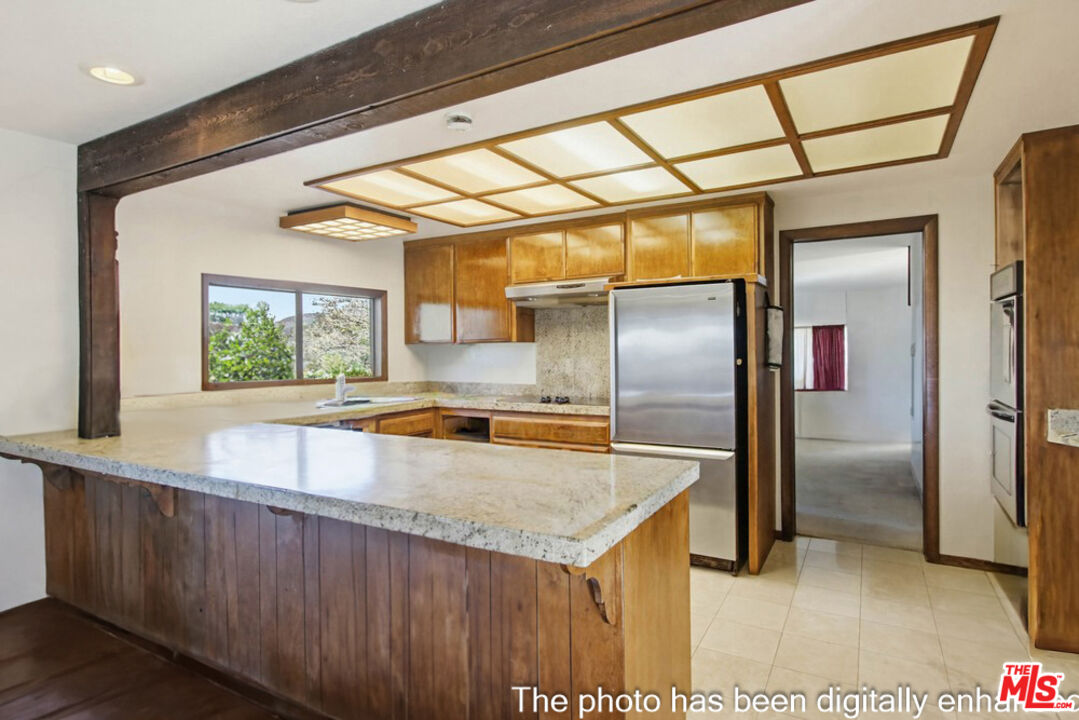 3709 Buena Creek Road Vista, CA 92084 - Photo 10 of 62 a view of a kitchen with a sink and large window