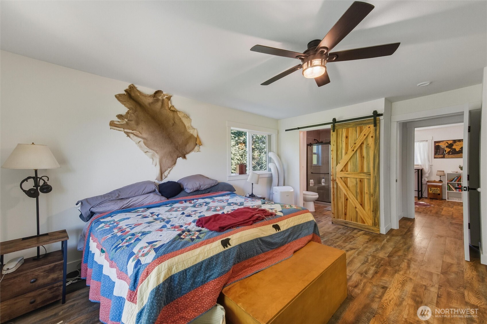 4955 South Pass Road Sumas, WA 98295 - Photo 17 of 40 a bedroom with a bed and a chandelier
