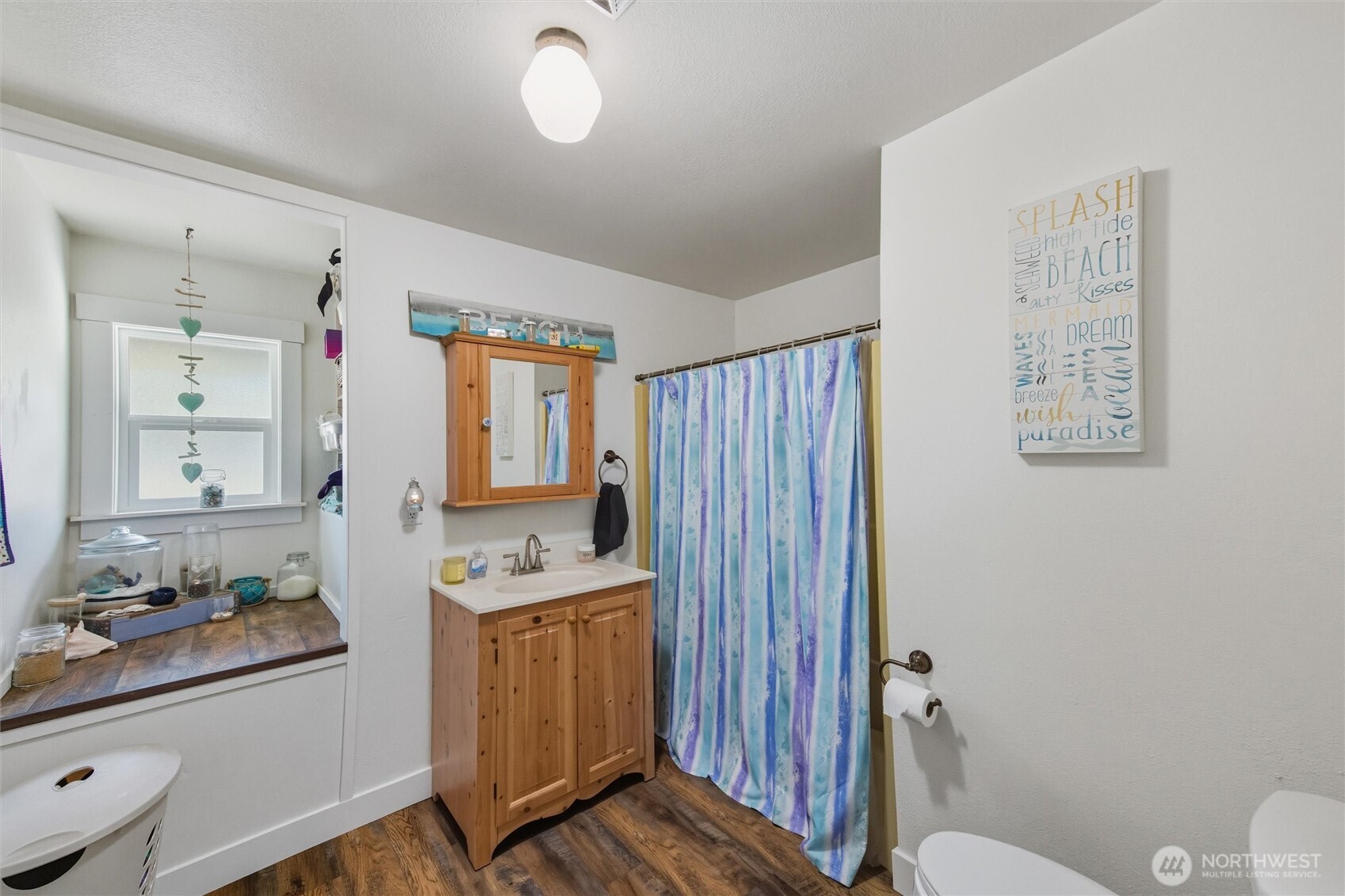 4955 South Pass Road Sumas, WA 98295 - Photo 22 of 40 a bathroom with a sink a toilet a mirror a vanity and shower