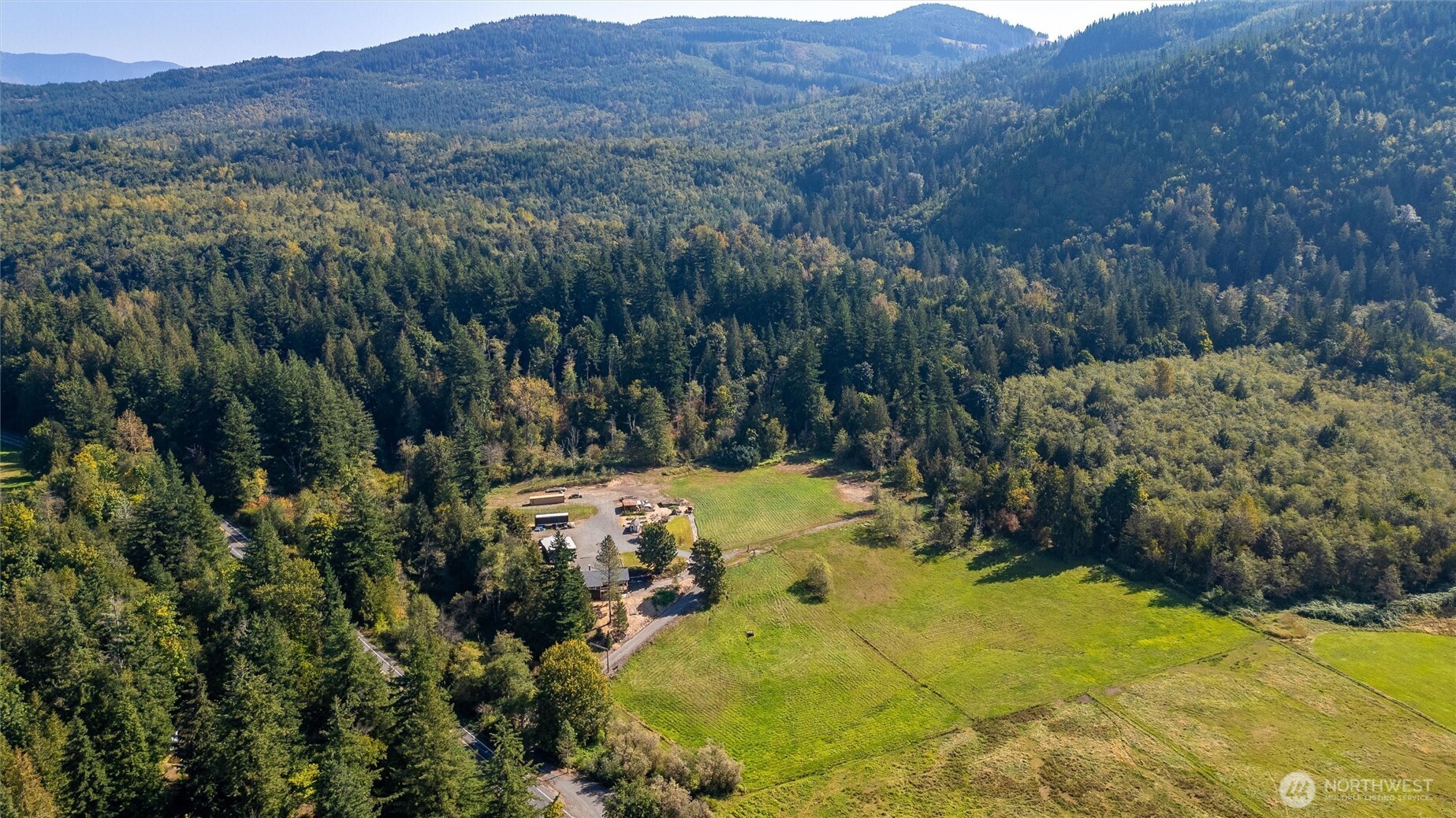 4955 South Pass Road Sumas, WA 98295 - Photo 32 of 40 a view of a lush green hillside and houses