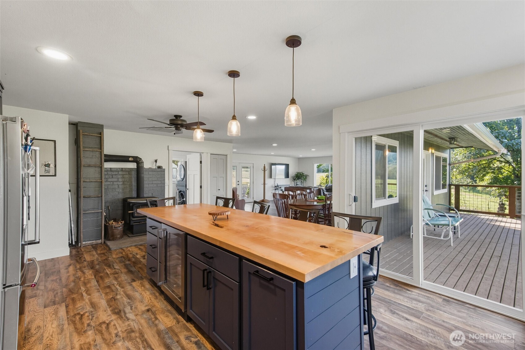 4955 South Pass Road Sumas, WA 98295 - Photo 6 of 40 a view of kitchen island a sink wooden floor and living room view