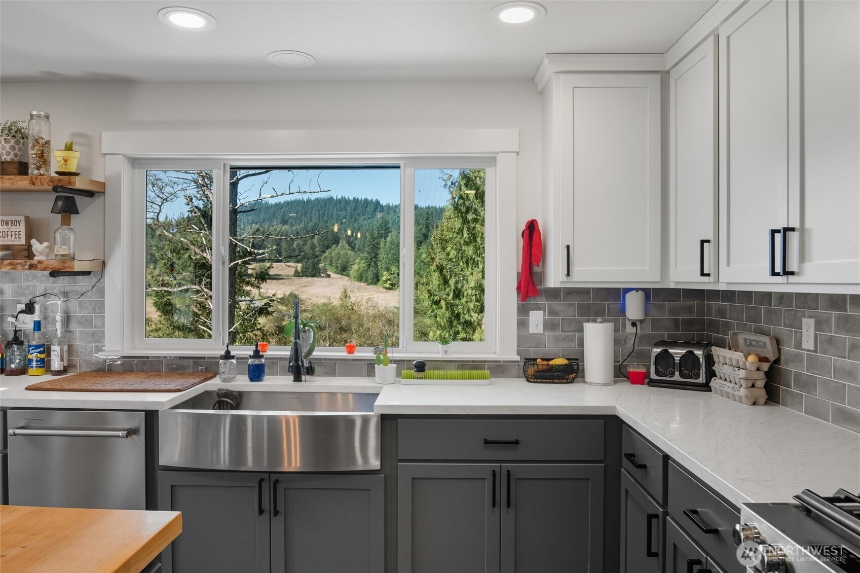 4955 South Pass Road Sumas, WA 98295 - Photo 7 of 40 a kitchen with a sink stove and cabinets
