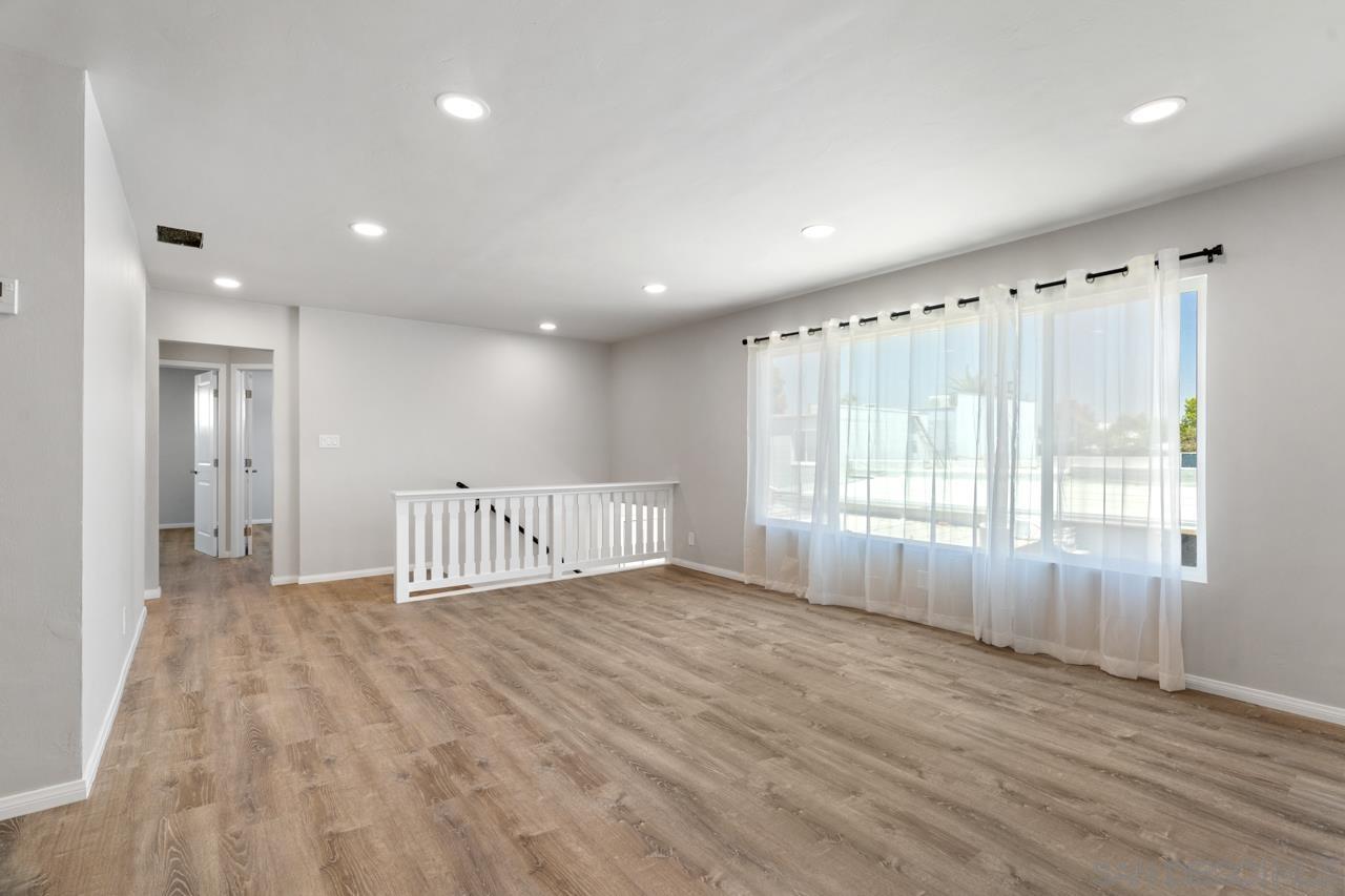 3276 Main Street Lemon Grove, CA 91945 - Photo 12 of 75 a view of an empty room with wooden floor and a window