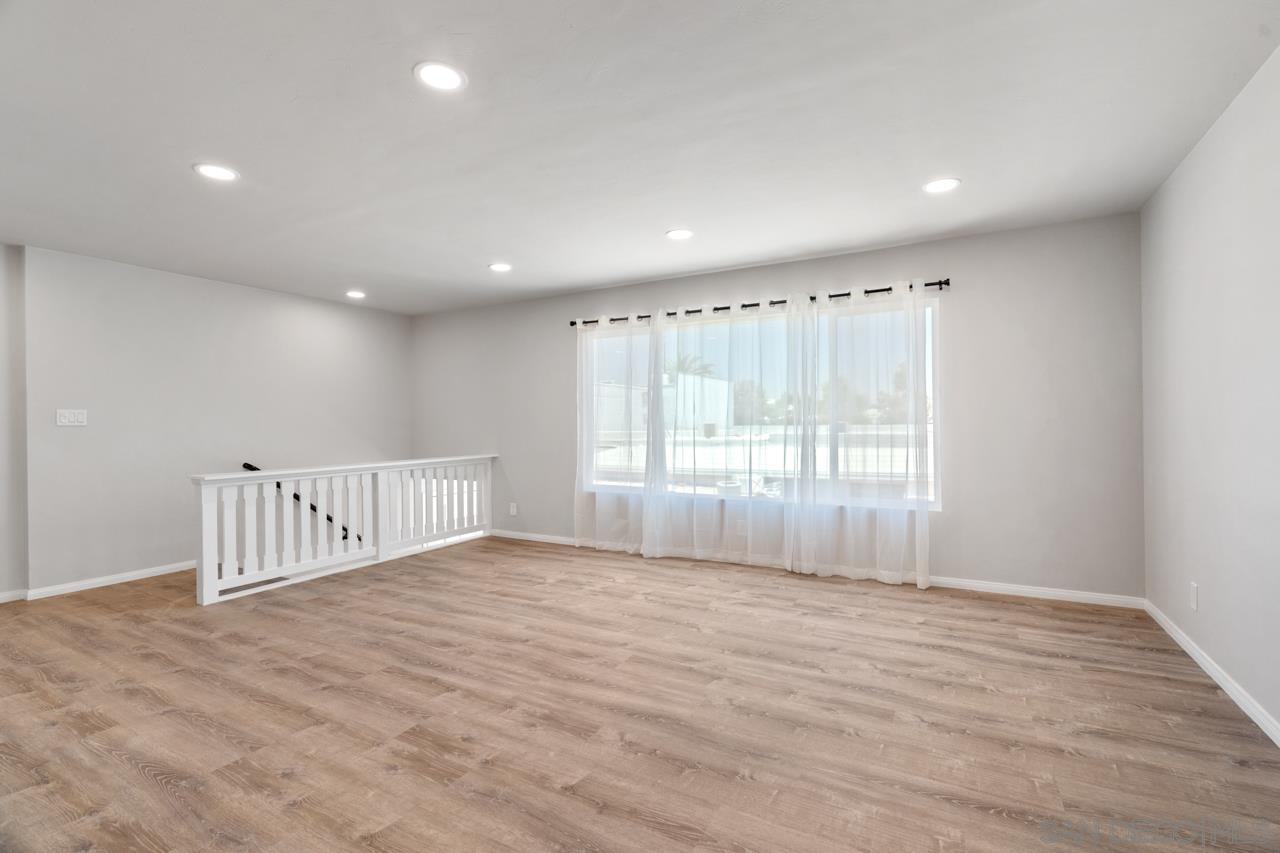 3276 Main Street Lemon Grove, CA 91945 - Photo 13 of 75 a view of an empty room with wooden floor and fence