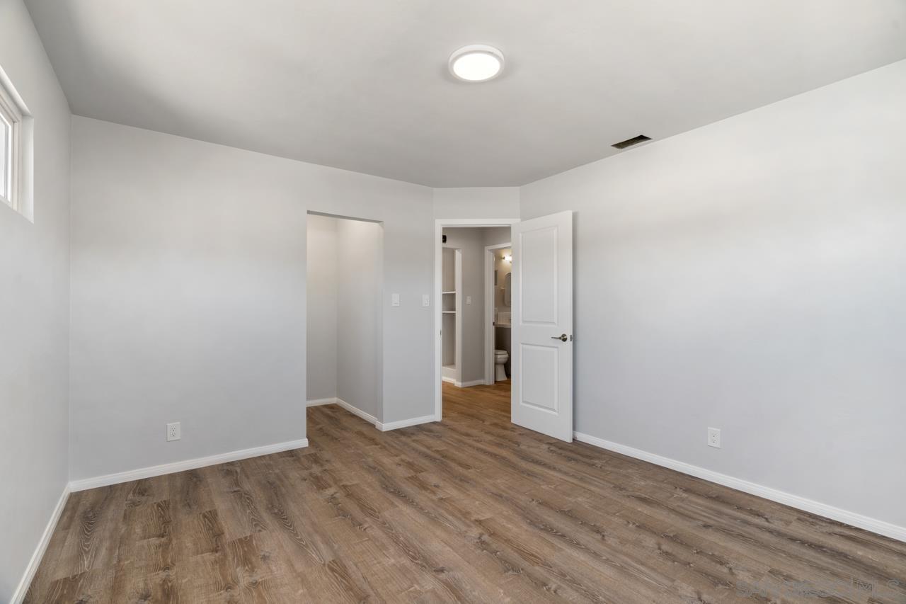 3276 Main Street Lemon Grove, CA 91945 - Photo 20 of 75 a view of an empty room with wooden floor and closet
