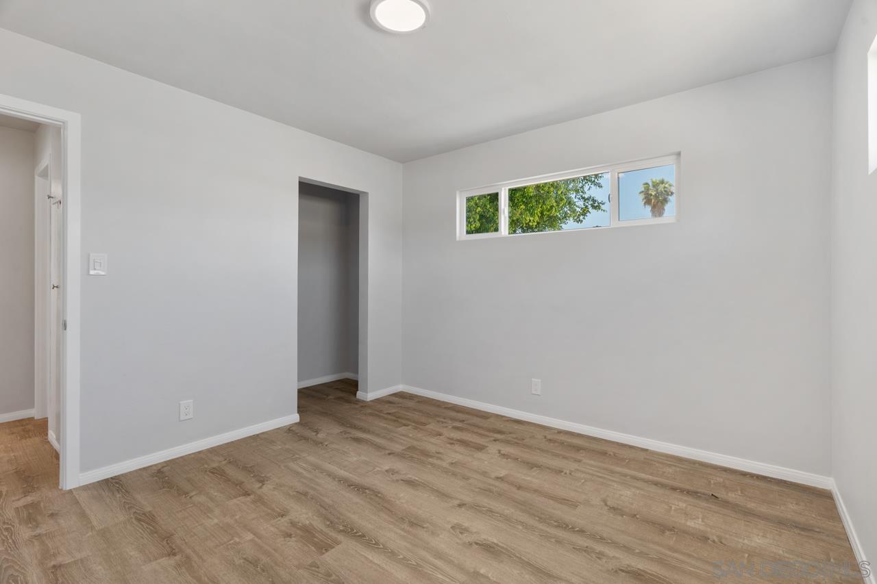 3276 Main Street Lemon Grove, CA 91945 - Photo 21 of 75 an empty room with wooden floor and windows