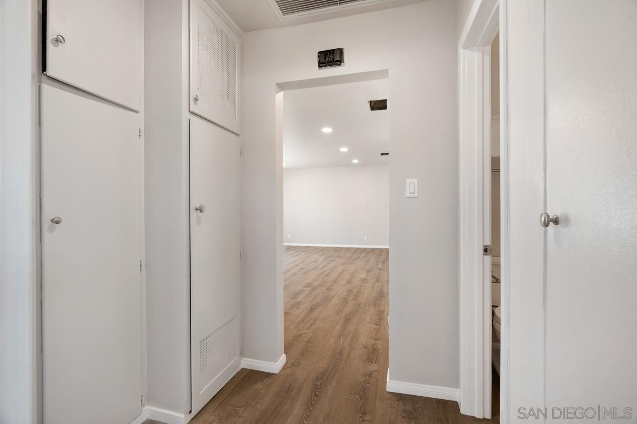 3276 Main Street Lemon Grove, CA 91945 - Photo 24 of 75 a view of a hallway with wooden floor