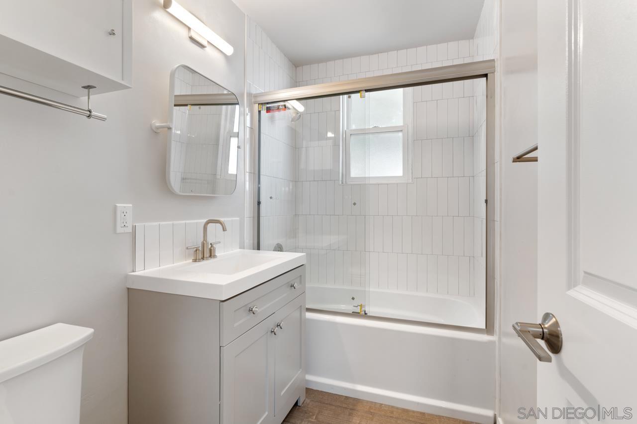 3276 Main Street Lemon Grove, CA 91945 - Photo 26 of 75 a bathroom with a shower sink vanity and toilet