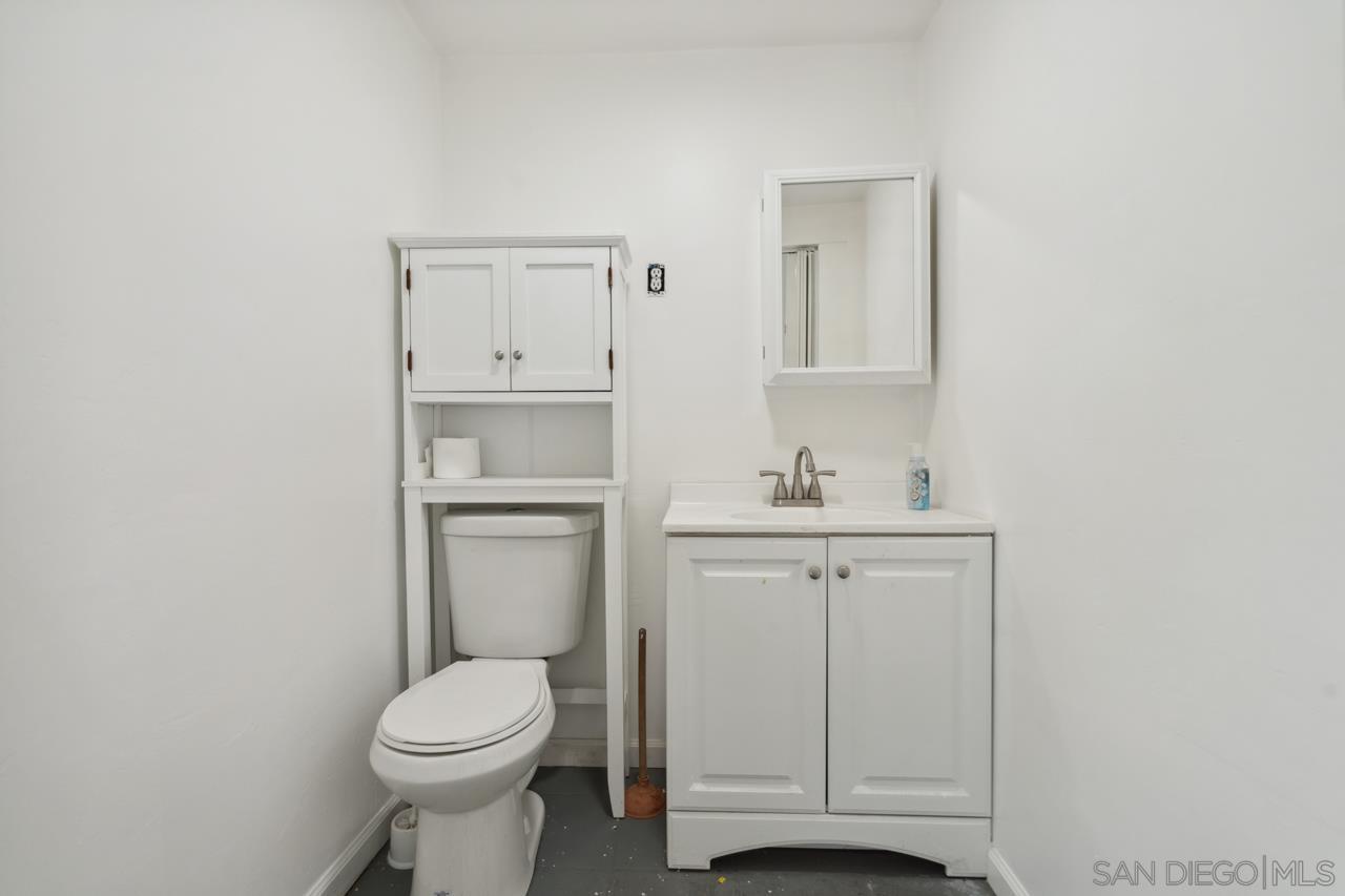 3276 Main Street Lemon Grove, CA 91945 - Photo 61 of 75 a bathroom with a white toilet sitting next to a sink