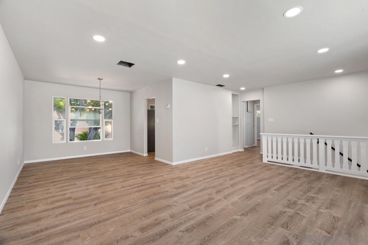 3276 Main Street Lemon Grove, CA 91945 - Photo 8 of 75 a view of an empty room with wooden floor and a window