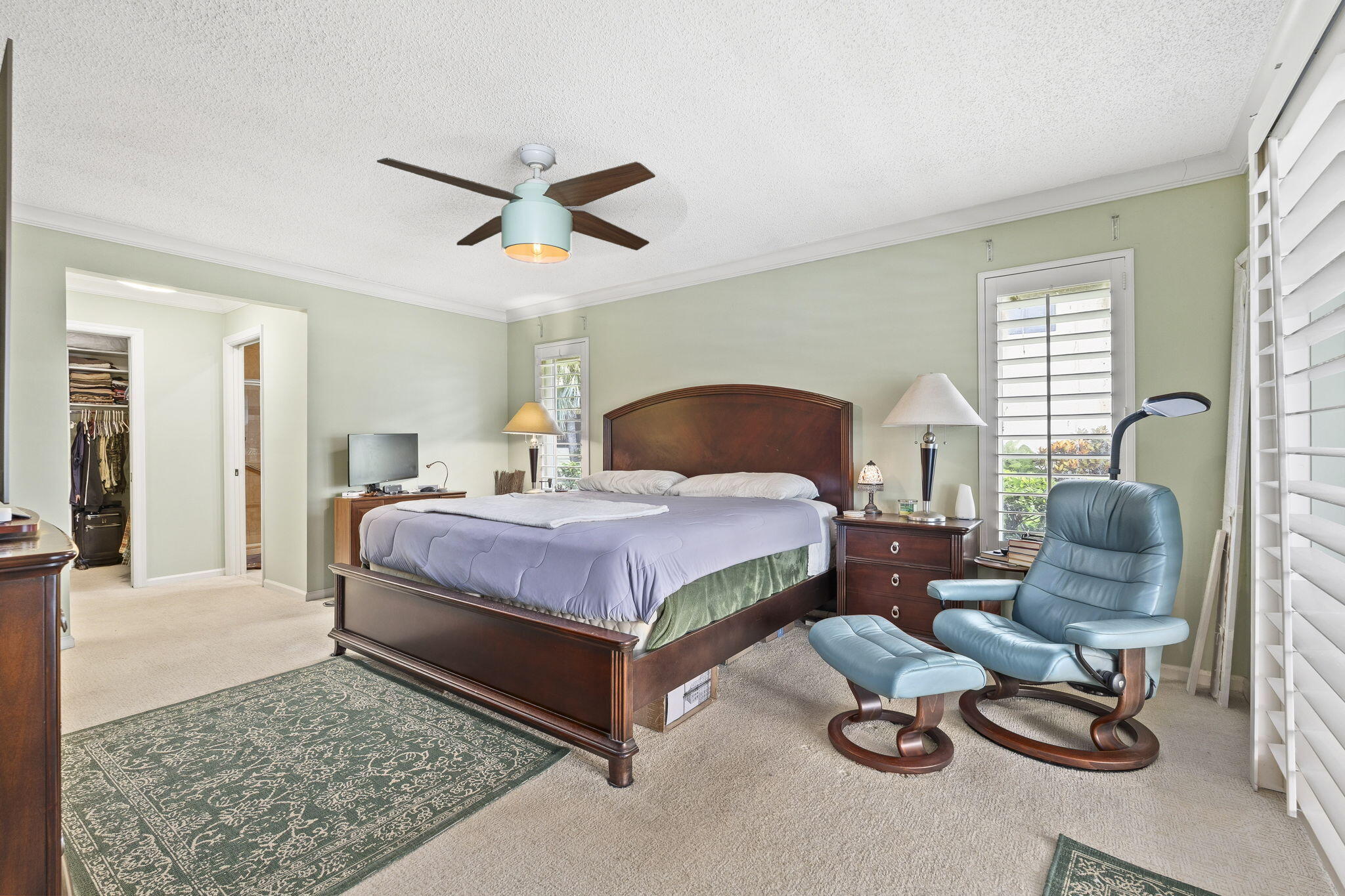 3374 Southeast Fairway East Stuart, FL 34997 - Photo 20 of 65 a bedroom with a bed and a couch