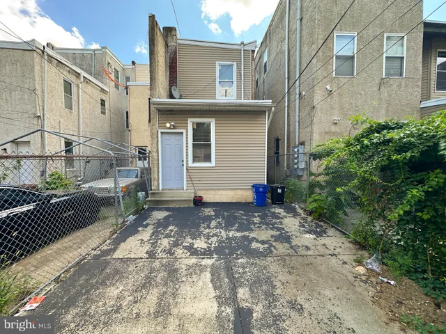 a view of a garage with a white car parked