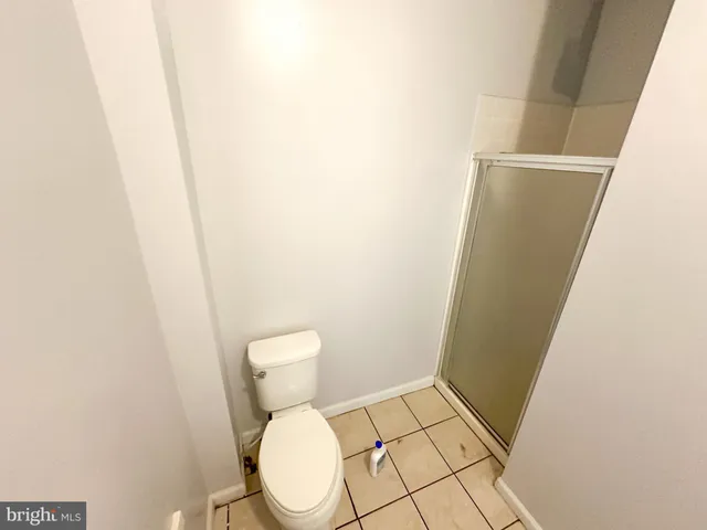 a room with wooden floor and furniture