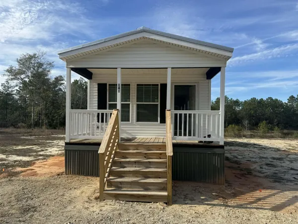 a front view of a house with a porch