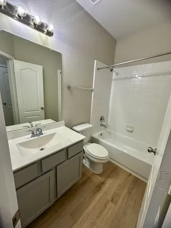 a view of hallway with wooden floor