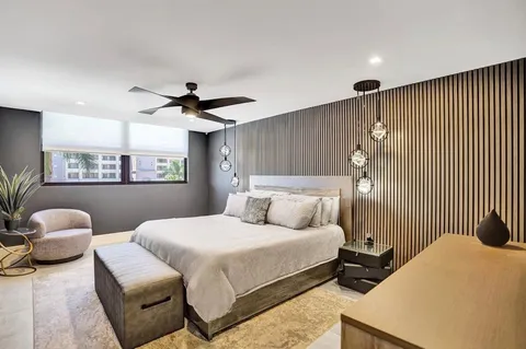 a bathroom with a shower sink and mirror