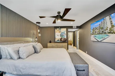 a bathroom with a sink a mirror a vanity and a shower