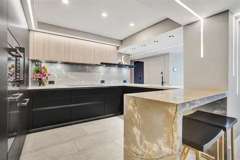 a kitchen with stainless steel appliances cabinets and a counter top space