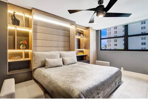 a bathroom with a sink a mirror a vanity and shower